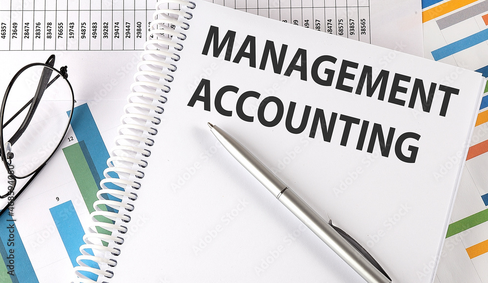 MANAGEMENT ACCOUNTING , pen and glasses on the chart, business concept MANAGEMENT ACCOUNTING , pen and glasses on the chart, business concept