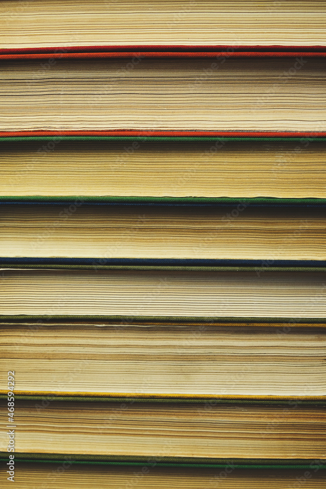 Background,stack of old books with yellowed pages. Background,stack of old books with yellowed pages.