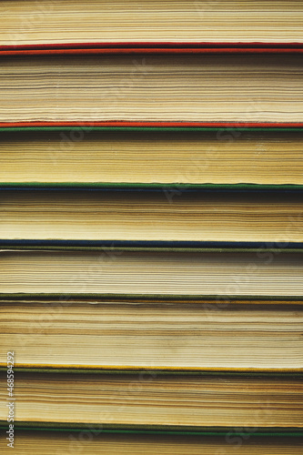 Background,stack of old books with yellowed pages.