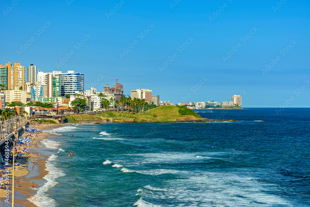Top view of Barra beach in Salvador, Bahia on a sunny summer day with the surrounding buildings.