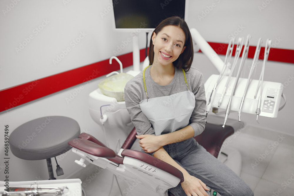 Beautiful girl sitting in the dentist's office Beautiful girl sitting in the dentist's office