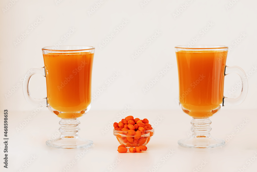 Sea buckthorn tea in a glass. Hot drink in winter. Sea buckthorn tea in a glass. Hot drink in winter.