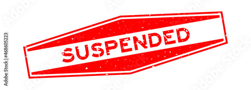 Grunge red suspended word hexagon rubber seal stamp on white background