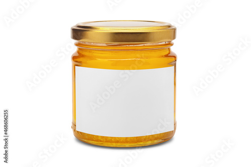 Glass jar full of sweet honey with white blank label isolated on black background. Product mock up.