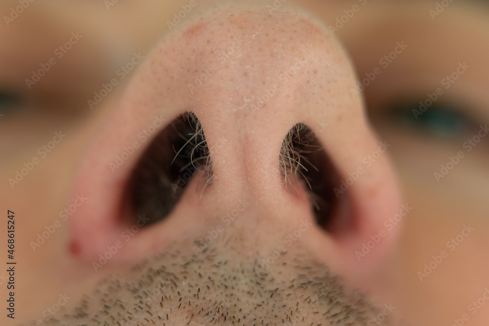 Caucasian male unkempt nose hair follicles macro close up shot. Close up shot, unrecognizable Caucasian male unkempt nose hair follicles macro close up shot. Close up shot, unrecognizable