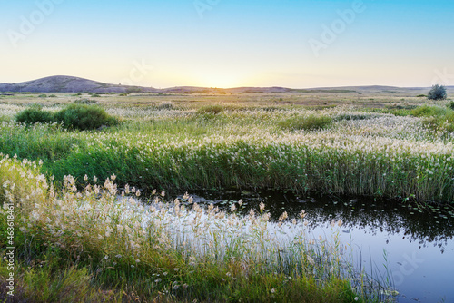 Evening summer landscape with a steppe river. Bolshaya Karaganka river near Arkaim village, Russia