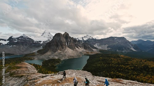 Mount Assiniboine with lake on Nublet peak in autumn forest at provincial park photo