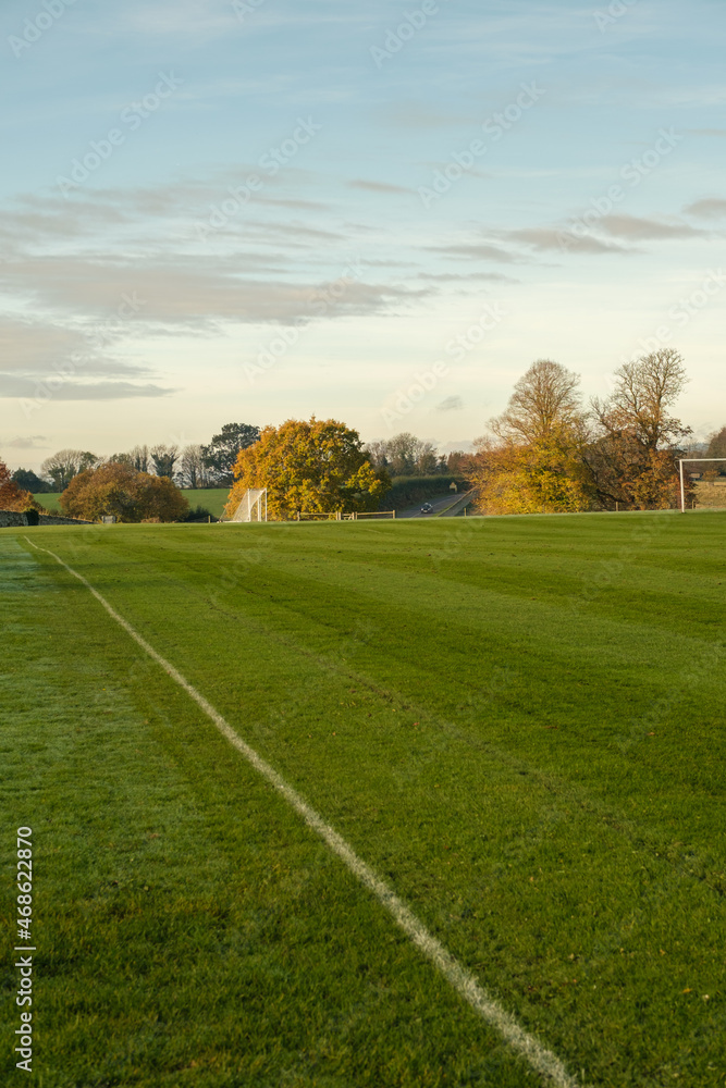 Naklejka premium Football pitch in autumn light