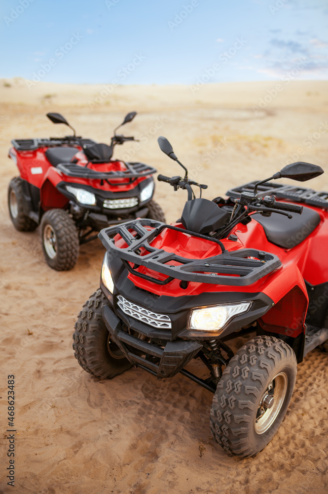 Two atvs in desert, quadbikes closeup, nobody Two atvs in desert, quadbikes closeup, nobody