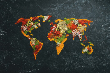 World map - Set of spices and condiments on a black background. Top view.