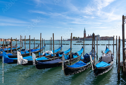 moored and tied up gondolas on the canals of Venice © makasana photo