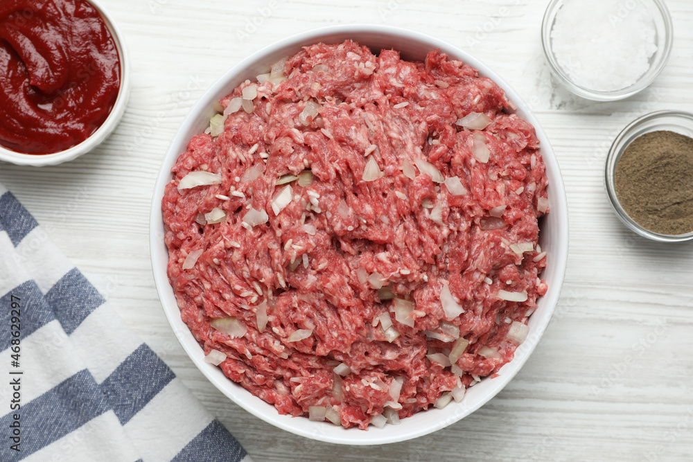 Meat filling in bowl for stuffed cabbage rolls on white wooden table, flat lay Meat filling in bowl for stuffed cabbage rolls on white wooden table, flat lay