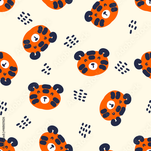 Hand drawn seamless pattern with tiger faces and dots. Perfect for T-shirt, textile and print. Doodle vector illustration for decor and design. 