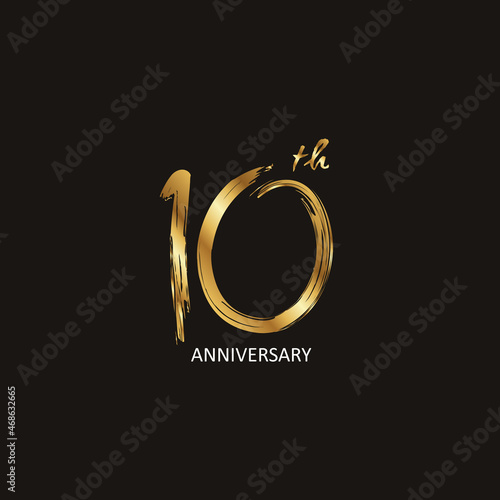 10 Years Anniversary logotype with golden colored font numbers made of brush lettering, isolated on black background for company celebration event, birthday