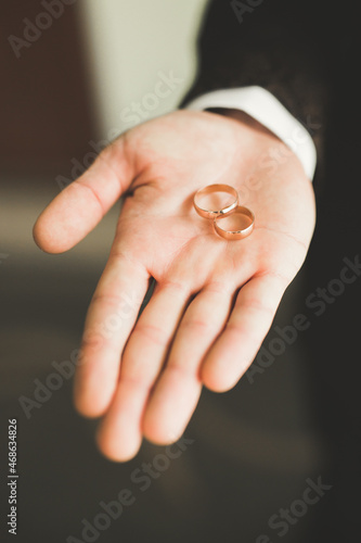 Two golden wedding rings isolated background concept