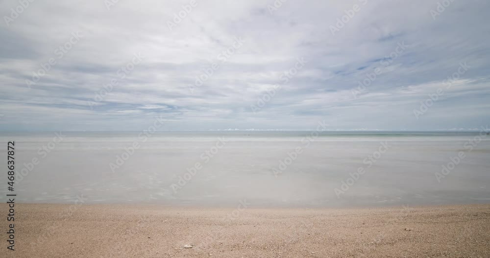 timelapse the beach with white sand and wave from peaceful sea in sunshine daytime timelapse the beach with white sand and wave from peaceful sea in sunshine daytime
