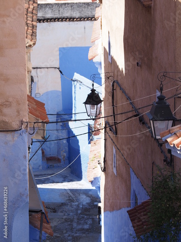 Frontage of moroccan alley in Chefchaouen city in Morocco - vertical photo