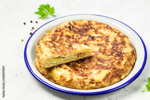 Spanish tortilla on light background. Space for text.