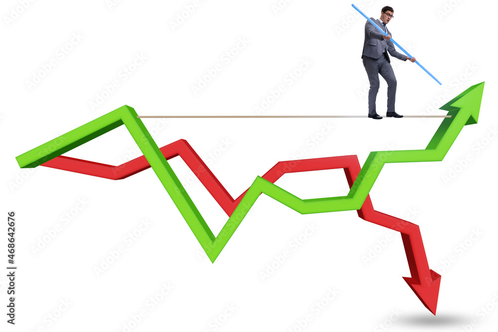Businessman balancing on tightrope on line chart Businessman balancing on tightrope on line chart