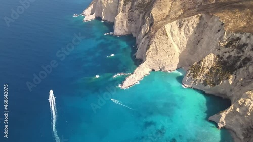 Wallpaper Mural Aerial drone view of the Ionian Sea coast of Zakynthos, Greece. Rocky ridge, floating boats, blue water Torontodigital.ca