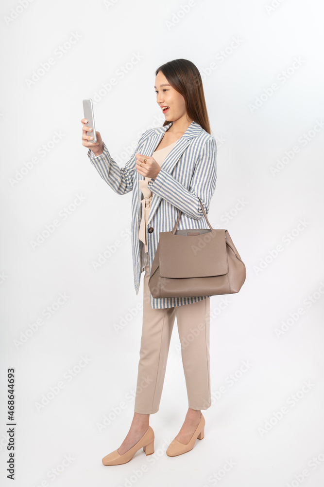 Photograph of a young asian office lady in her office outfit with a bag, focus on different mood and expression Photograph of a young asian office lady in her office outfit with a bag, focus on different mood and expression
