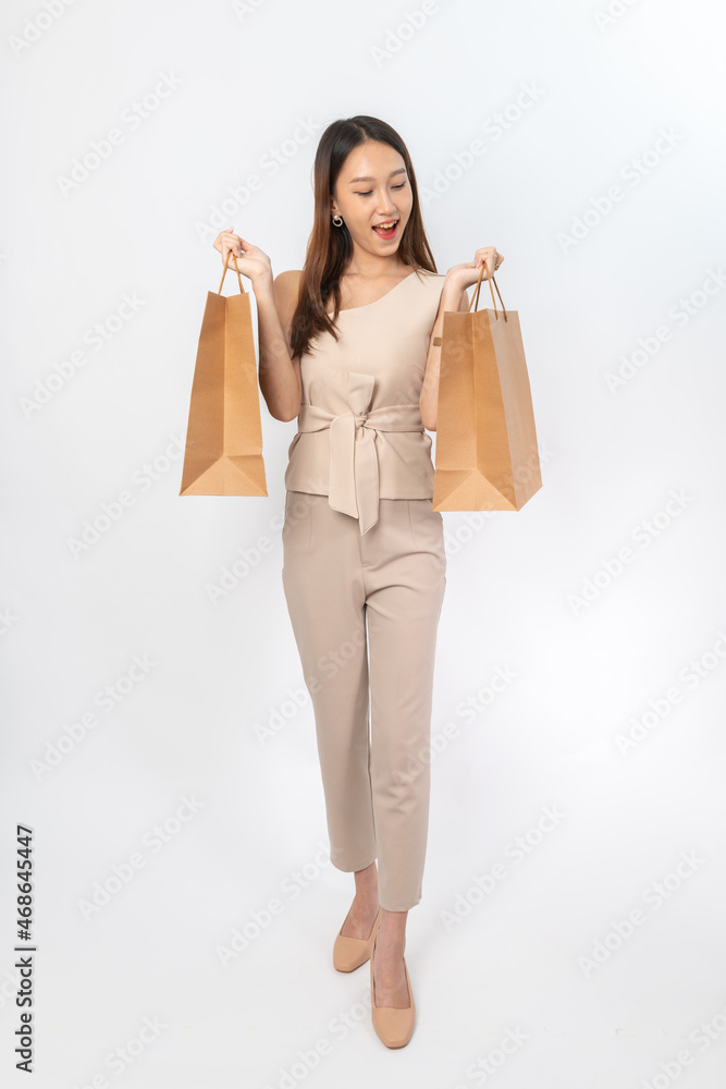 A series of photo collection focusing on the moments, expression and gestures of an asian office lady with brown shopping bag that also look like delivery bag. All are full body, high resolution shots A series of photo collection focusing on the moments, expression and gestures of an asian office lady with brown shopping bag that also look like delivery bag. All are full body, high resolution shots
