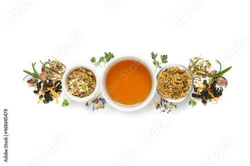 Composition with freshly brewed tea and dry leaves on white background, top view
