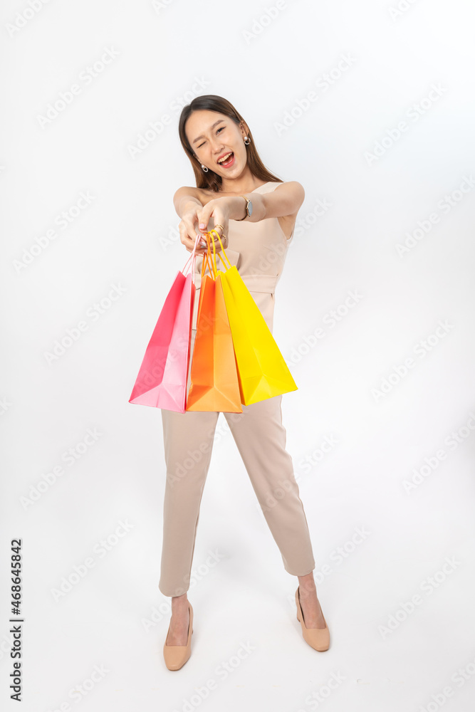 Photograph of a collective series of young asian lady with colorful shopping bags with different expression, moods and gesture. Very suitable for all kind of media application and usage. Photograph of a collective series of young asian lady with colorful shopping bags with different expression, moods and gesture. Very suitable for all kind of media application and usage.