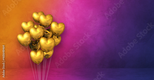 Gold heart shape balloons bunch on a rainbow wall background. Horizontal banner.