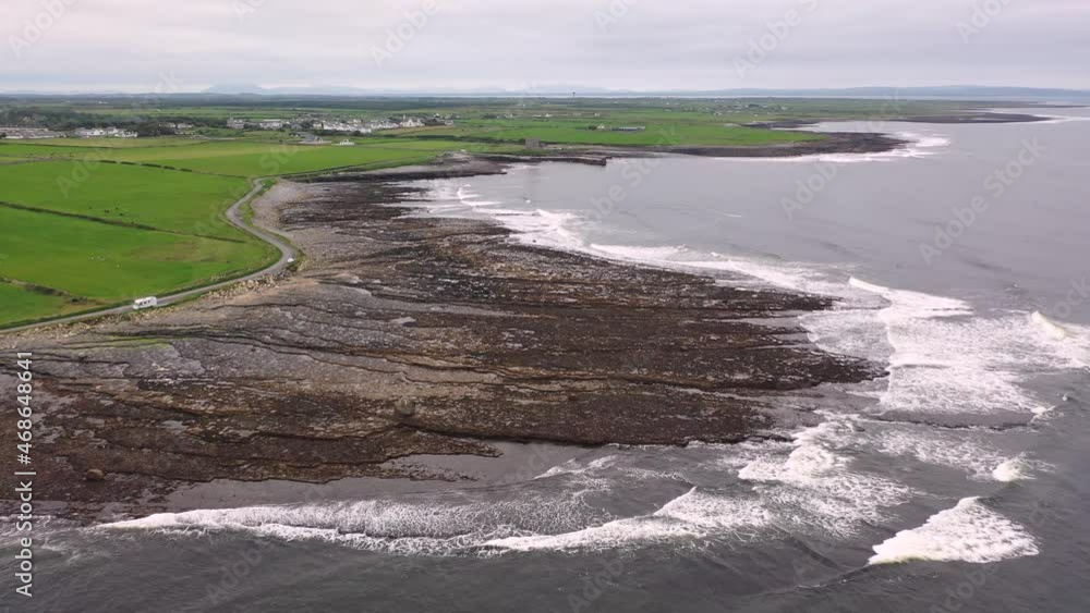 Reef at Easky Castle and pier in County Sligo - Republic of Ireland Reef at Easky Castle and pier in County Sligo - Republic of Ireland