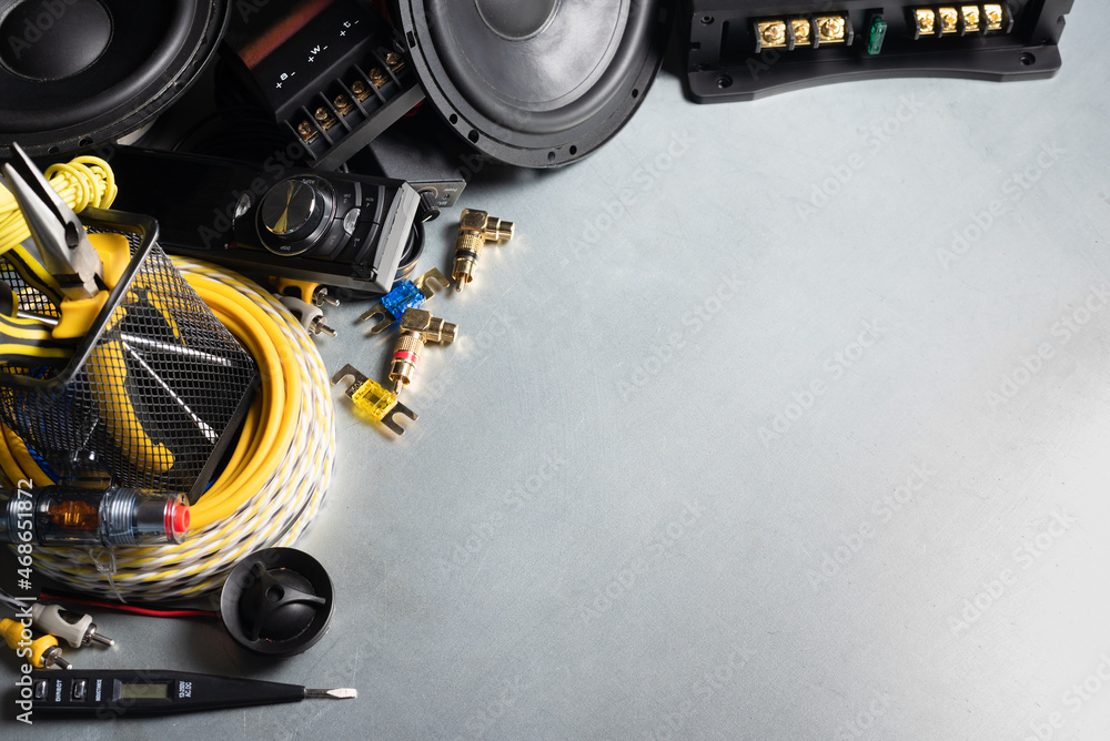 Car audio stereo equipment on the workbench background with copy space