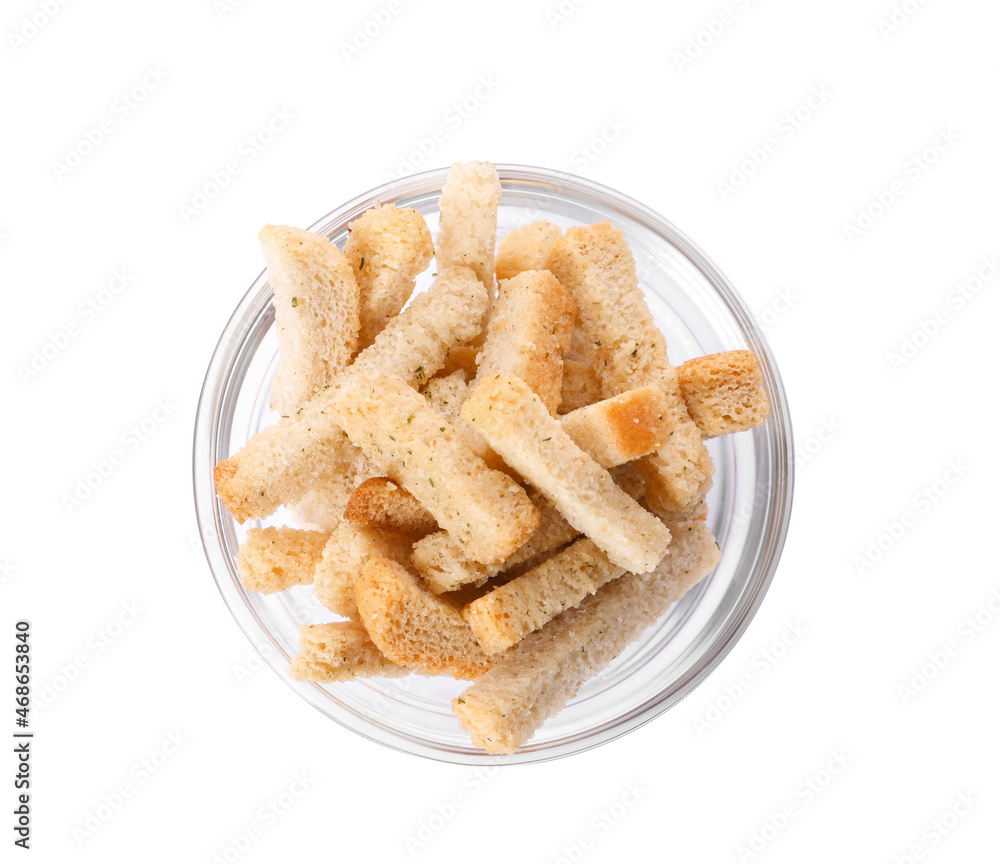 Crispy rusks in bowl isolated on white, top view