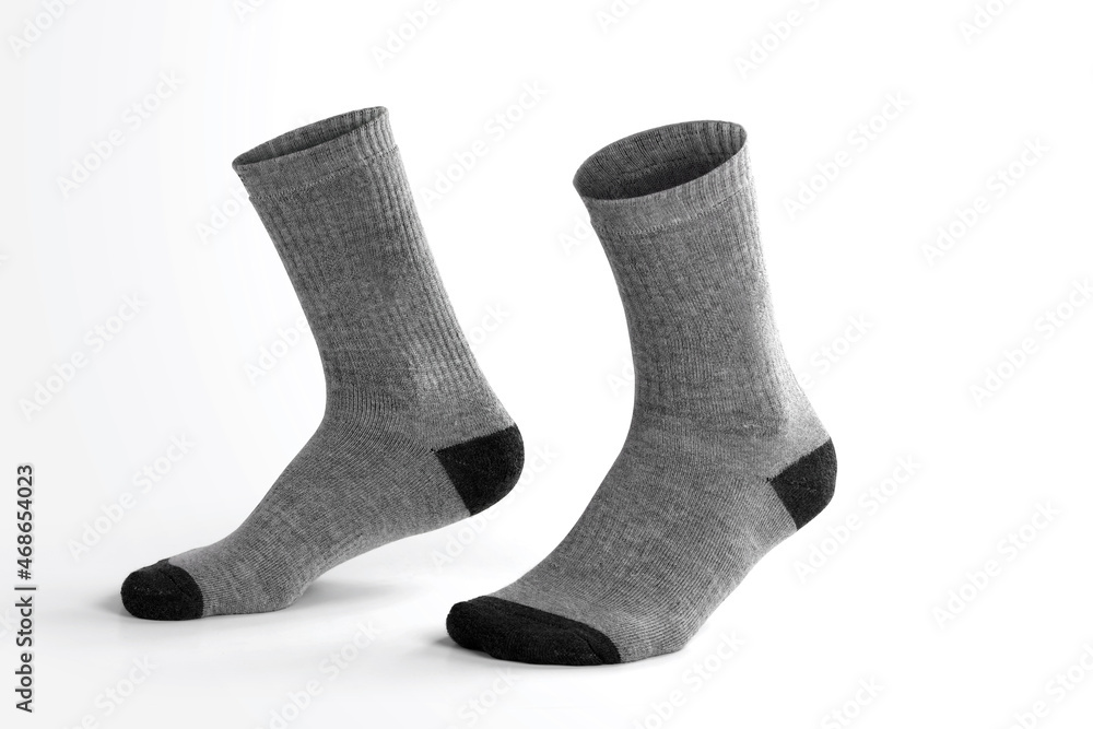 Gray socks with isolated leg shape on white background Gray socks with isolated leg shape on white background