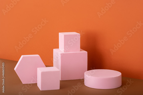 Cosmetic background for product presentation. Pink podium on brown background © iwavephoto