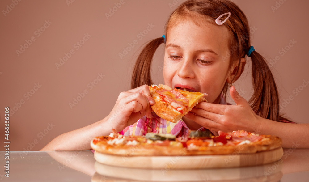 Young beautiful attractive girl enjoys delicious slice of pizza. Copy space. Horizontal image.