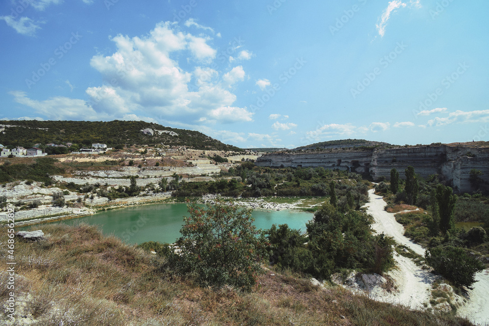 Photo of an old stone quarry with a lake formed in it