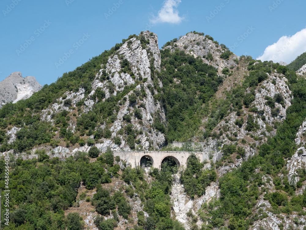 Bridge among Mountain in Carrara, site of the Old Private Marble Railway - Tuscany, Italy