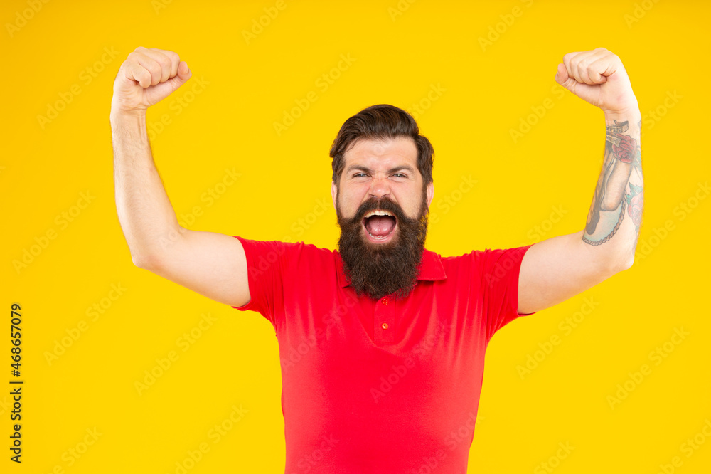 Fototapeta premium shouting bearded man with moustache in tshirt on yellow background, aggression