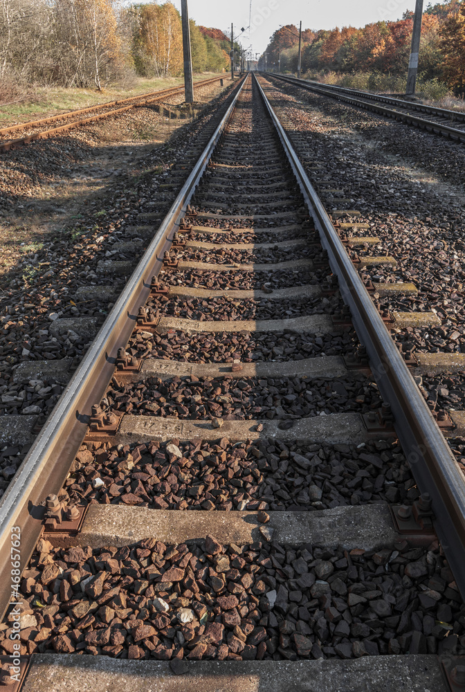 view of the rails from a low perspective, close-up of the rails and railway sleepers.