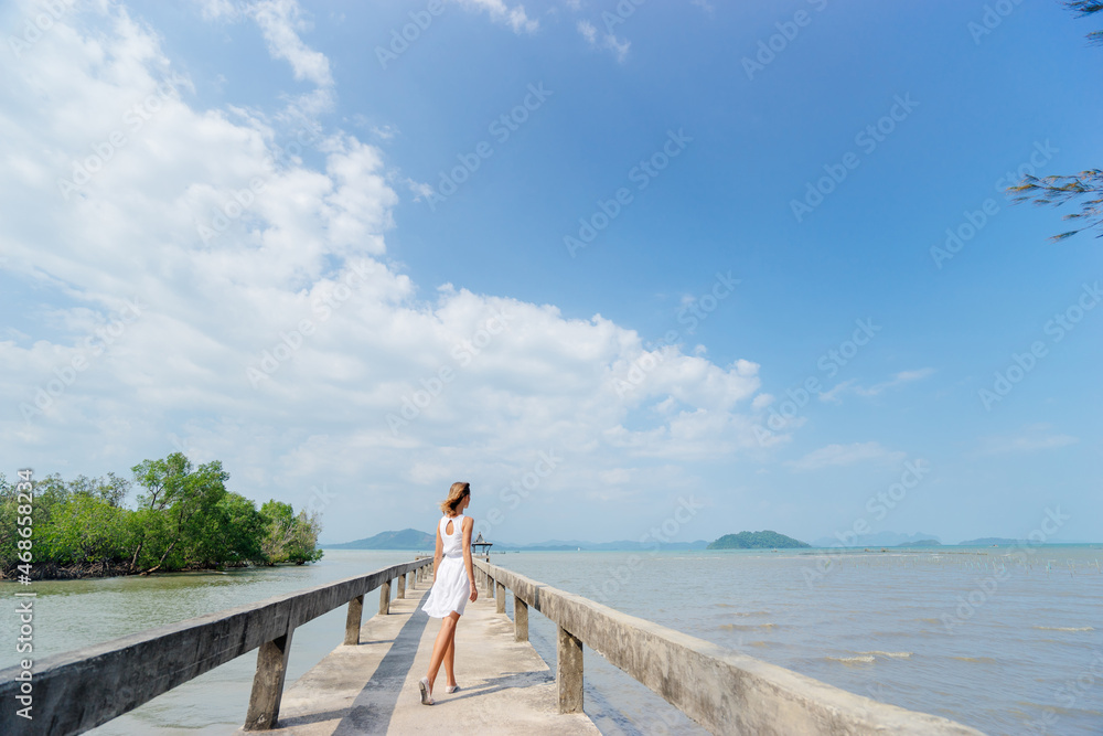 Woman on pier.