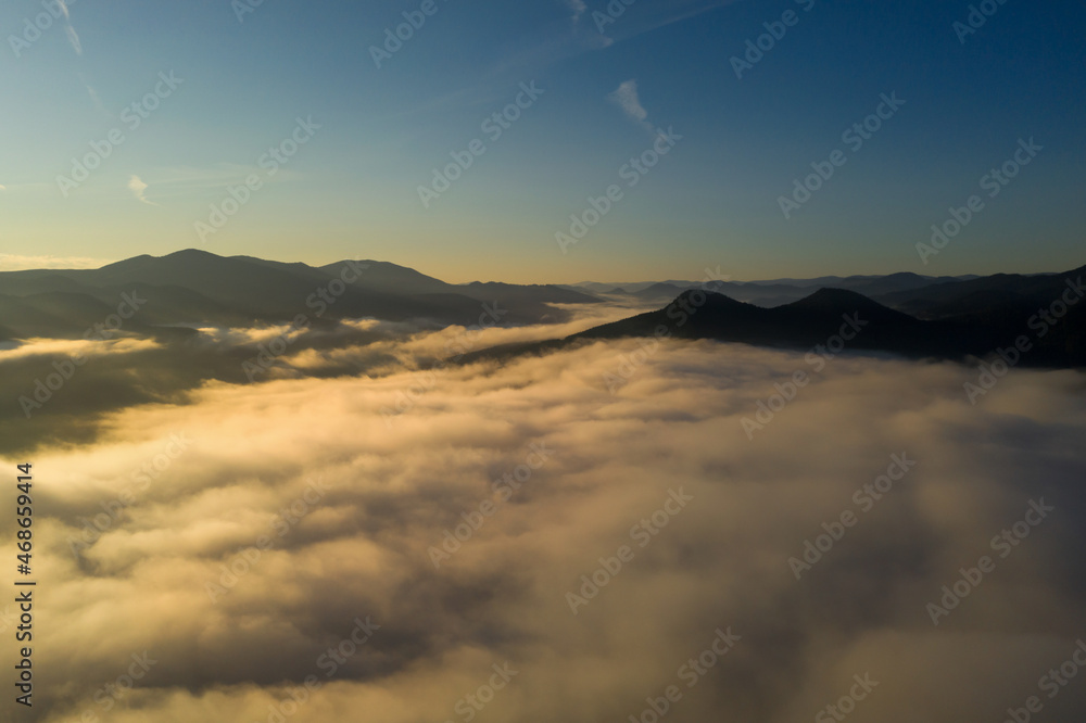 Beautiful landscape with thick mist in mountains. Drone photography Beautiful landscape with thick mist in mountains. Drone photography