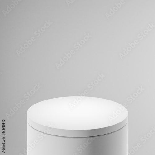 White cylindrical pedestal or podium, light gray background. Mock up design for showcase, display case, shopfront. 3d render.