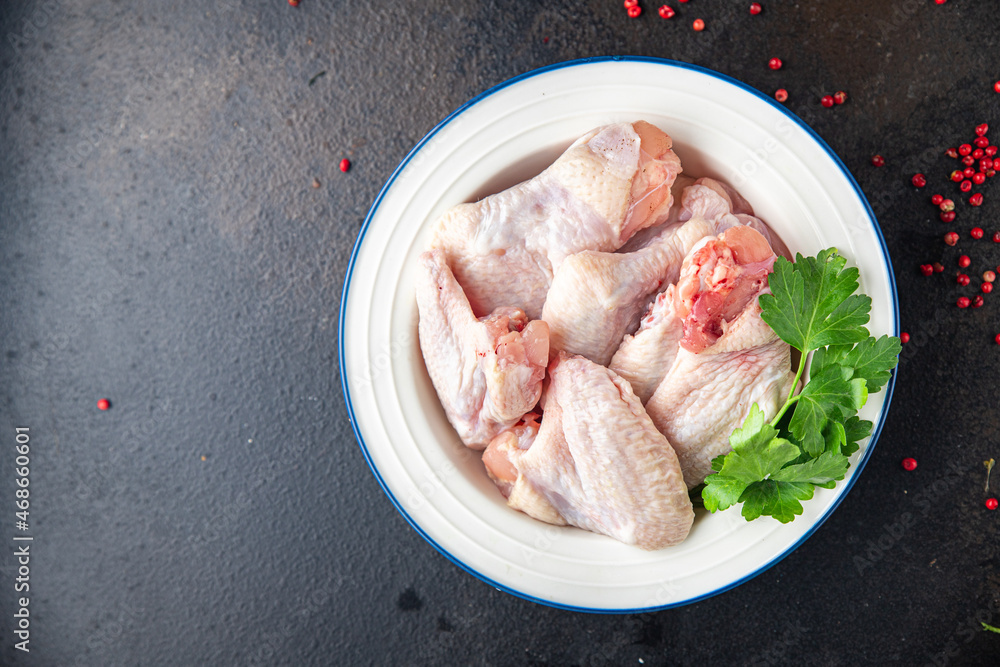 raw chicken wings meat poultry fresh meal snack on the table copy space food background rustic. top view keto or paleo diet raw chicken wings meat poultry fresh meal snack on the table copy space food background rustic. top view keto or paleo diet