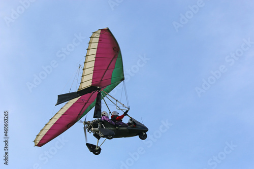 Valokuva Ultralight airplane flying in a blue sky