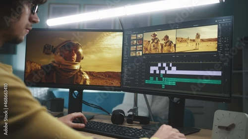 Focused man editing astronaut video photo