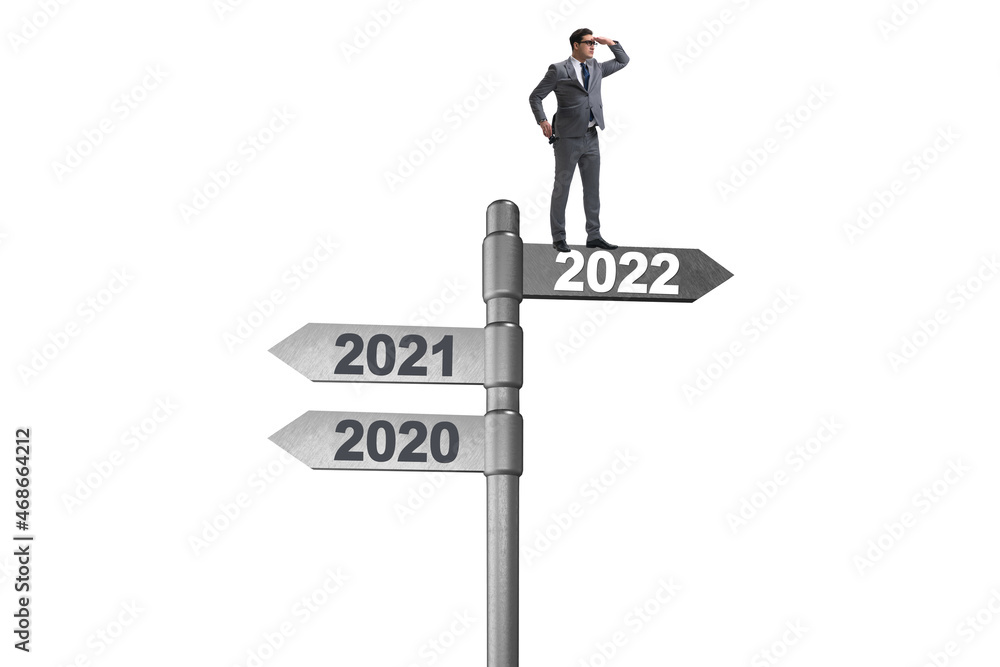 Businessman on the signpost from 2021 to 2022 Businessman on the signpost from 2021 to 2022