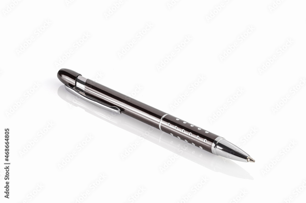 Side view of a ballpoint pen, isolated on a white background. Close-up. Full depth of field. Side view of a ballpoint pen, isolated on a white background. Close-up. Full depth of field.