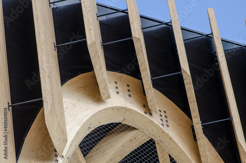 wooden structures: Glulam, structural panel details on a modern building. Also used as a sunshade. photo