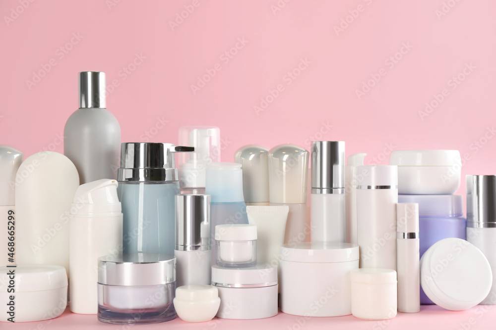 Many different cosmetic products on pink background Many different cosmetic products on pink background