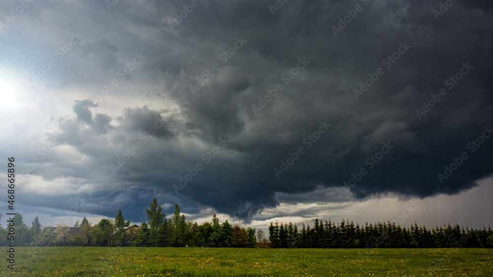 Angry Storm Clouds at summer in the meadow